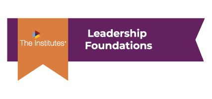 A purple badge with an orange ribbon and the words Leadership Foundations