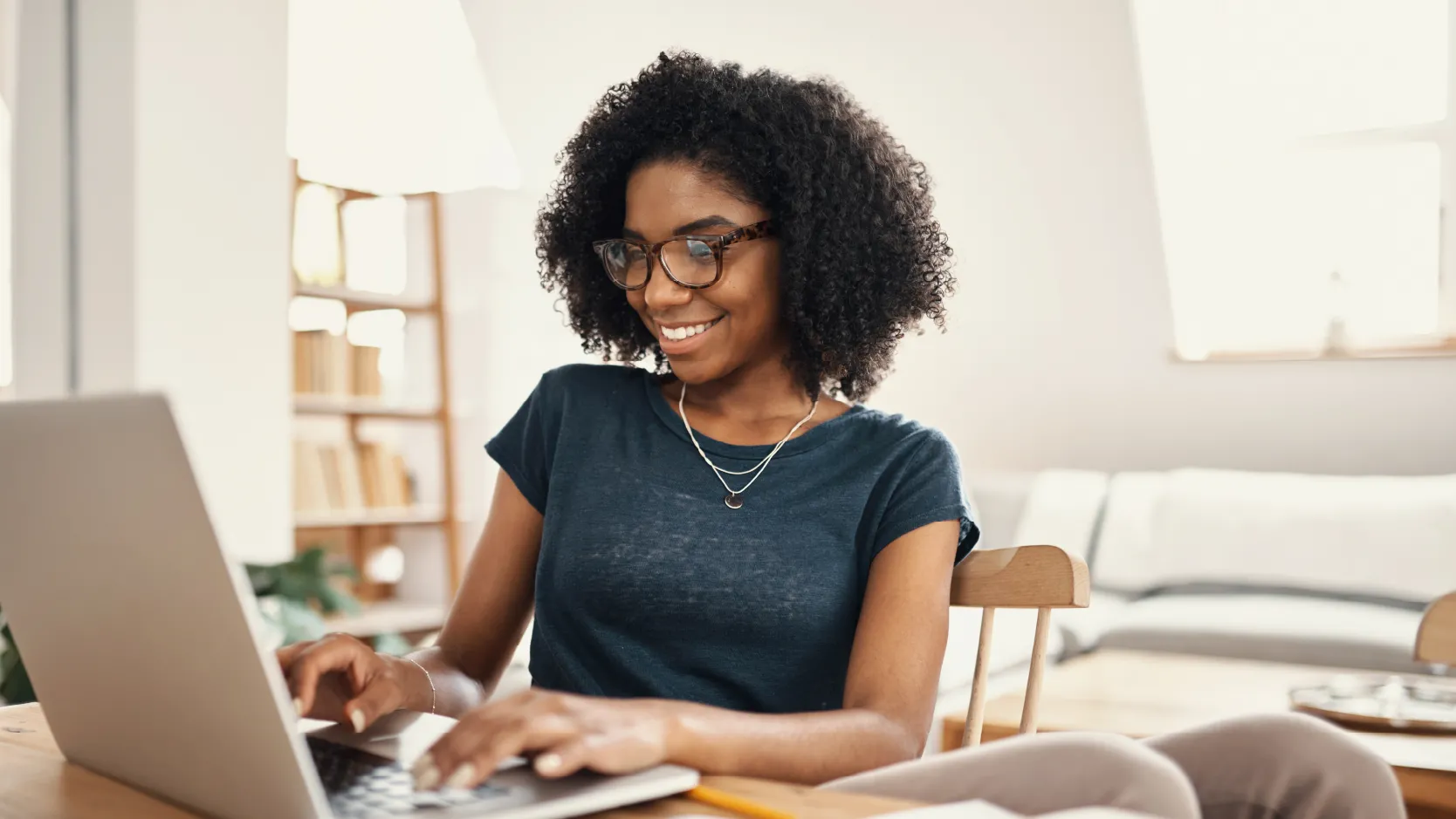 Image of a woman at laptop demonstrating best practices for how to study for professional exams