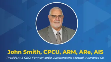 Professional headshot of John Smith, CPCU, ARM, ARe, AIS, on a blue geometric background 