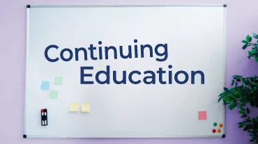  Continuing Education Written on a Whiteboard