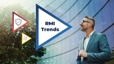 Professional standing outside a modern office building alongside graphic elements highlighting risk management and insurance industry trends.