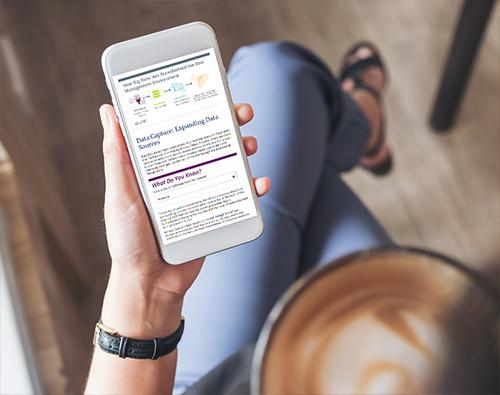 A person looking at a phone screen with course content on it