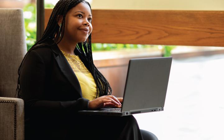 Professional thinking while typing on a computer. 