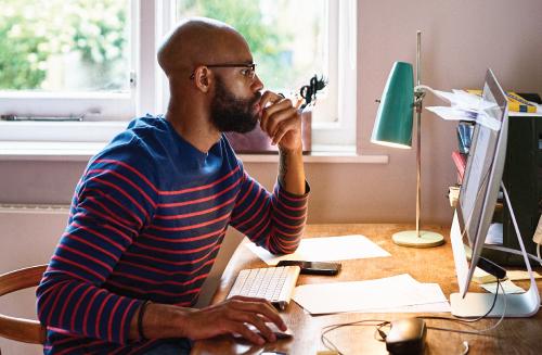 Man at computer studying