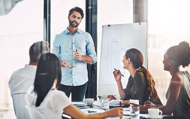 Man presenting data to group