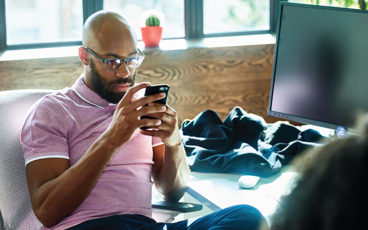Man reading a cell phone