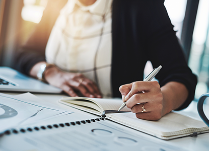 Woman writing in notebook