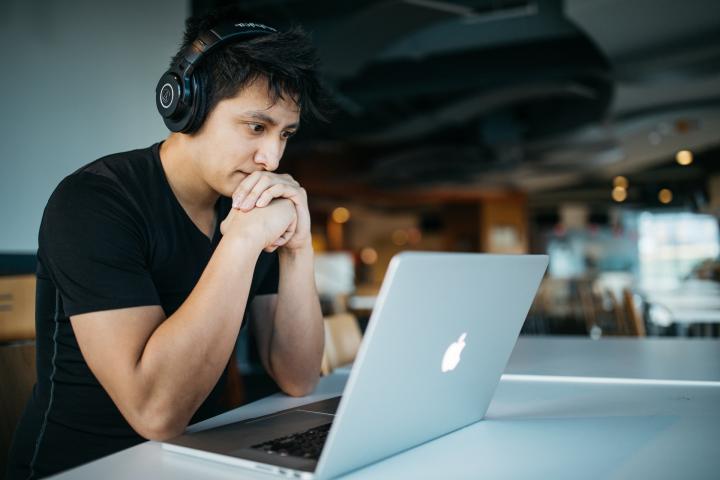 man studying with headphones