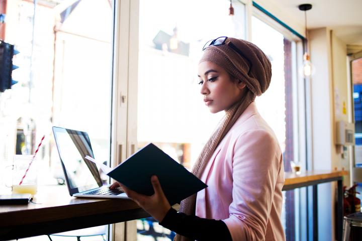 Young woman working in a cafe