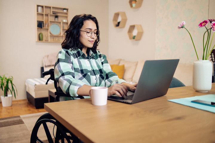 A woman in her home office studying