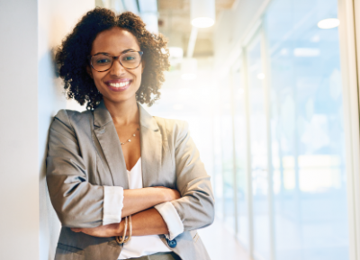 woman smiling with arms crossed