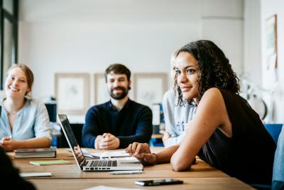 A group of coworkers together at a meeting