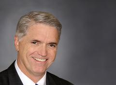 close up headshot of man smiling