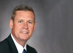 close up headshot of man smiling